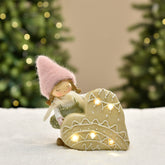 Figurine de Noël Fillette à bonnet rose sur Coeur LED